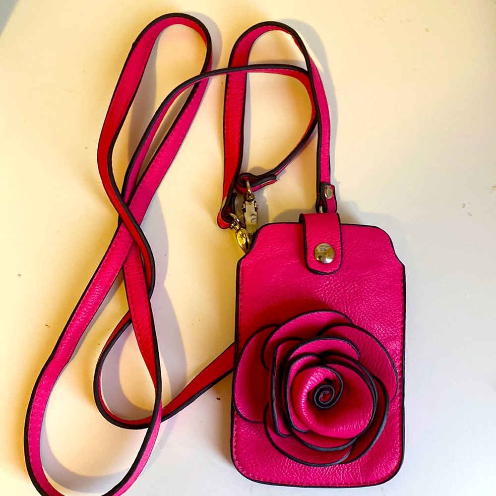 Small cell phone purse. Comes with body strap and pocket for cards